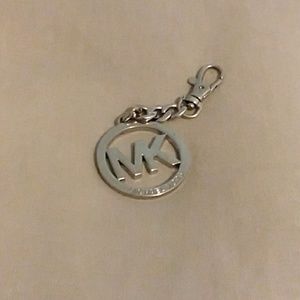 Silver Michael Kors detachable Bag Emblem